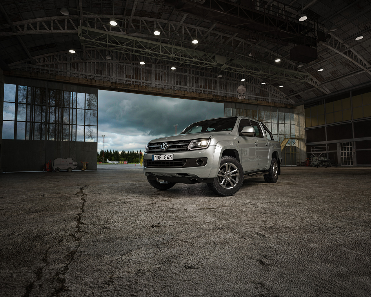 Volkswagen Caddy, Transporter, Crafter, Amarok and Eup at the airport hangar. Electric e-load up with the airplanes. An airport with landinpath. flygplats 